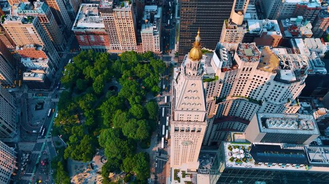 Aerial perspective on the cupola of the Metropolitan Life Insurance Company Tower. Drone footage above the greenery of the Madison Park. Sunny New York, USA.
