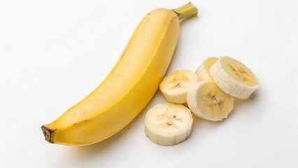 A ripe yellow banana with several slices on a white background