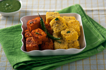 Vadodara, Gujarat / India - January 07, 2015 : Spicy Khaman, an Indian snack.