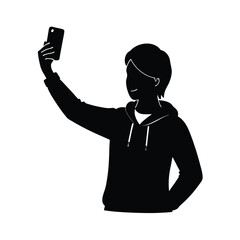 Black silhouette of a young person taking a selfie with a smartphone youth male