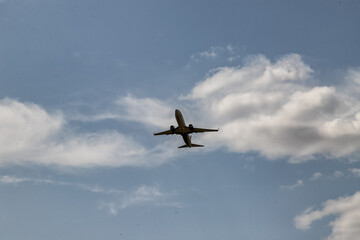 A jet passenger plane flies in the clouds
