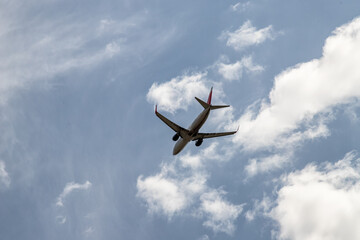 A jet passenger plane flies in the clouds