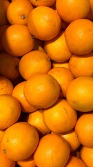Fresh Oranges for sale in a market. Healthy Fruits at the food market.