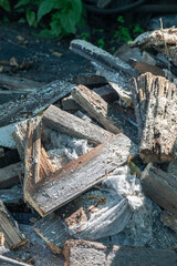 A close-up view showcases weathered wooden planks and scattered sawdust details.