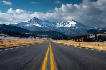 Fototapeta premium Road Leading to Snowy Mountain Peaks.