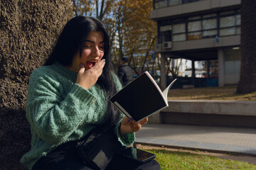 woman caught reading a novel in the park