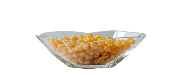  Ultra-modern angular glass bowl with clear, sharp lines holding golden raisins. Clean white backdrop enhances the geometric silhouette.

