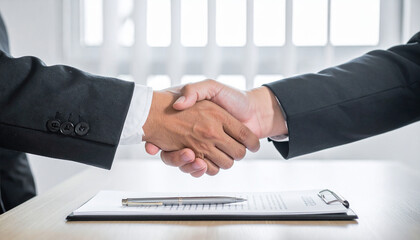 Professional Businessmen Handshake Over Table Making a Deal Shoulder View Studio Style for Corporate Agreement Partnership or Business Success Concept


