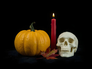 Halloween skull and pumpkin ghost on black background