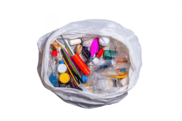 Plastic bag overflowing with assorted colorful waste