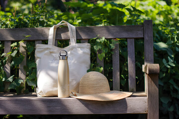 Relaxing Outdoor Scene with Hat and Water Bottle