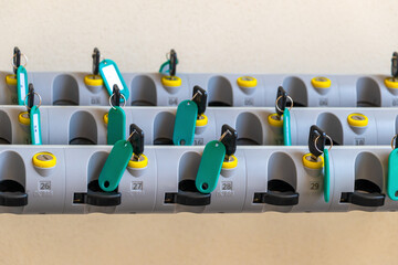 Organized key storage system with numbered tags and secure holders