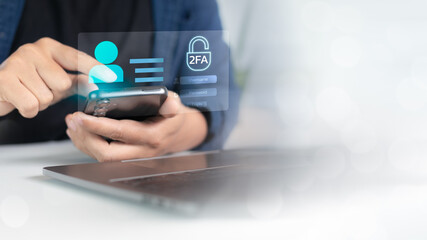 Hand using smartphone with two-factor authentication 2FA login interface, cybersecurity concept for digital identity and data protection.