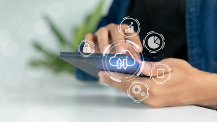 Hand using tablet with cloud computing icon, digital data storage, business analytics, and online...