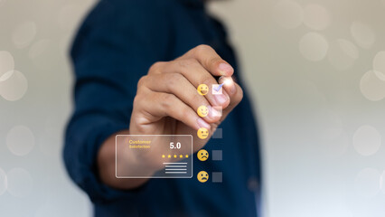 Hand selecting positive emoji in customer satisfaction survey with five-star rating, feedback review, and digital customer experience evaluation concept.
