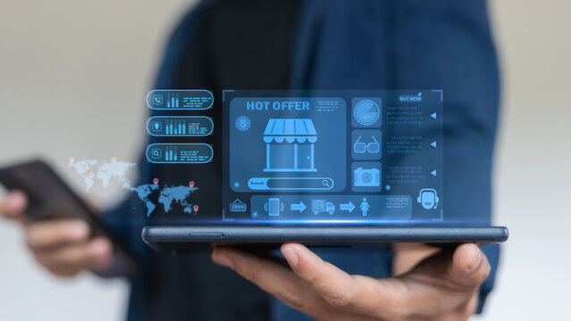 Hand holding tablet with e-commerce online shopping interface, digital marketing, product promotion, hot offer, and global online business concept.