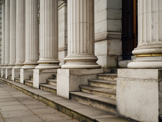 Stone colonnade and stairs detail. Classical pillars row in a building facade
