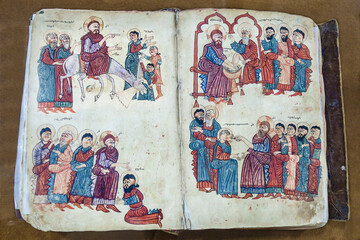 Armenian Gospel from 1391, opened to a page with scenes from the life of Jesus Christ. Vank Cathedral Museum, Isfahan, Iran