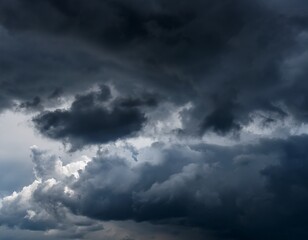 Obraz premium the sky is dark and cloudy with a few clouds scattered throughout