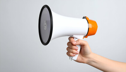 Hand holding megaphone with announcement.