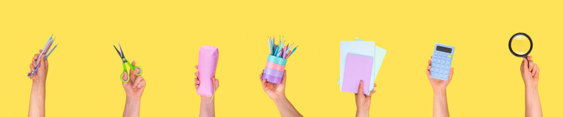 Back to school sale and shopping. Variety of school stationery in children's hands - pencils,...
