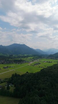 Vertical drone establishing of Lake Wolfgangsee and Strobl Town surrounded by Salzburg&rsquo;s summer scenery