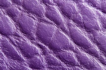Fototapeta premium Macro shot of textured purple leather with a quilted pattern showing detailed grain and subtle reflections