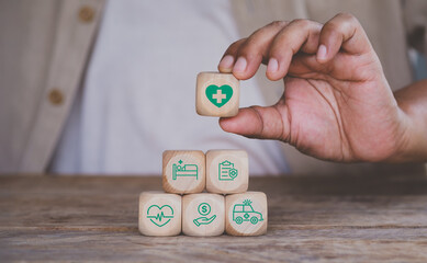 Health insurance concept. Health care checkup and healthy trends. Access to welfare health. Wellness and medical. Hand hold wooden block with icon healthcare medical. World health day