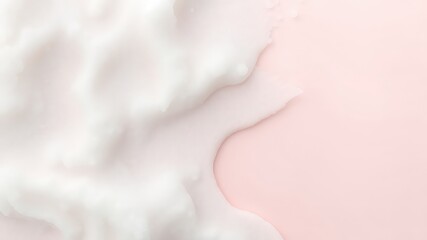 Fototapeta premium Delicate white foam spills across a pastel pink backdrop, creating a soft and visually appealing abstract texture.