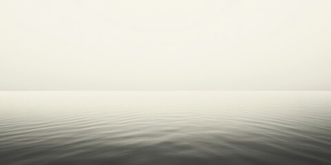 Calm water surface on a hazy day.