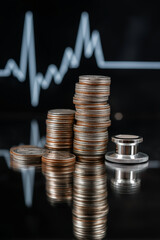 Stacks of coins reflect on glossy surface with heartbeat line in background, symbolizing intersection of financial markets and healthcare