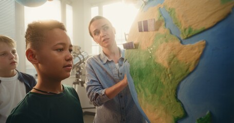 Science STEM Lesson: Female Teacher Educating Renewable Energy to Team of Smart Kids in Multiethnic...