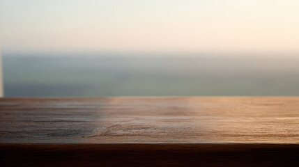 Obraz premium Natural wood desktop by window with sunrise light