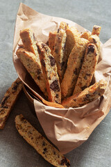 homemade chocolate pistachio biscotti Italian biscuit in paper lines bowl.