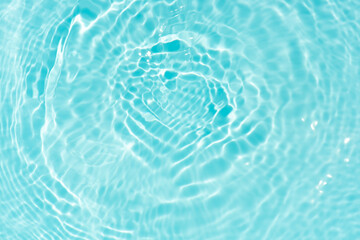 Blue water with ripples on the surface. Defocus blurred transparent blue colored clear calm water...