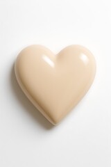 Obraz premium Beige heart form with smooth texture isolated on white background, evoking calm and gentle feelings.