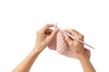 Hands holding pink knitted fabric with metal needles, showing ribbed pattern, isolated on a transparent background