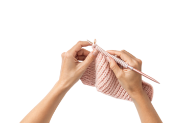 Hands holding pink knitted fabric with metal needles, showing ribbed pattern, isolated on a transparent background