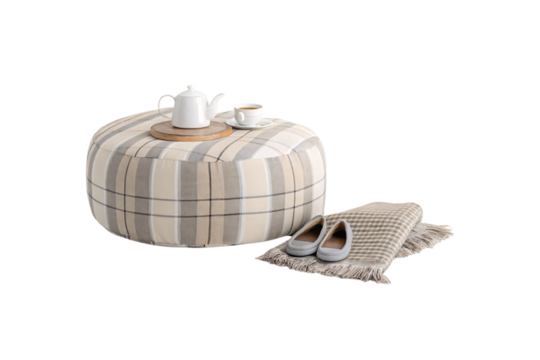 Large plaid upholstered round ottoman with white teapot, cup, and women's ballet flats displayed elegantly, isolated on a transparent background - Powered by Adobe