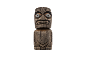 Wooden carved totem figure with wide eyes, geometric patterns and traditional indigenous design elements, isolated on a transparent background
