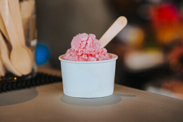 Strawberry ice cream in a cup, strawberry gelato in a cup