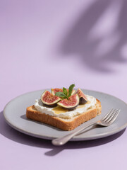 A delicious toast topped with cream, fresh figs, honey, and mint on a gray plate, set against a pastel purple background.