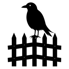 Fototapeta premium Elegant black silhouette of a bird perched on a rustic wooden fence