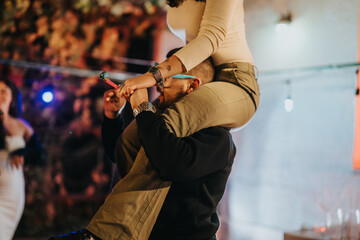 A fun-filled evening with friends coming together to celebrate a special occasion, featuring decorations, party props, and candid moments at a festive gathering.