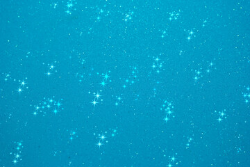 Glittering blue background filled with shining stars creates a dreamy and enchanting atmosphere suitable for various projects