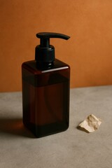 A brown pump bottle with a black dispenser, positioned on a textured surface, offering a clean and minimalist aesthetic. A piece of crumpled paper adds to the composition