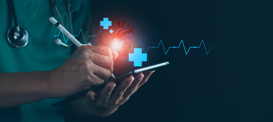 Cardiologist doctor hand using tablet examine patient heart functions and blood vessel. Medical...