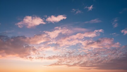 cumulus cirrus clouds on pale pink and gold sky with glow shine light up natural background