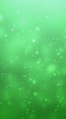 Green bokeh glitter particles background with copy space