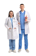 Medical students with human body model on white background